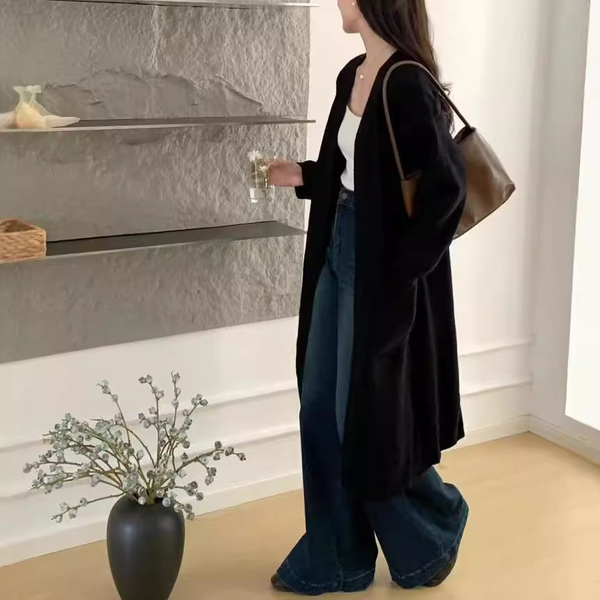 Damer Lång stickad cardigan med praktiska fickor och avslappnad passform Mirla-Eva Jonsson