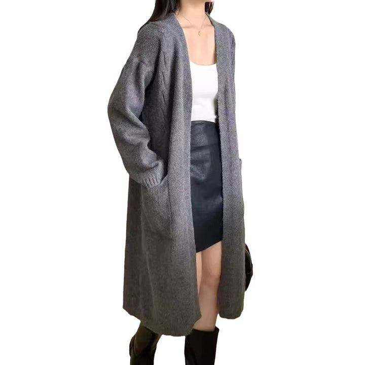 Damer Lång stickad cardigan med praktiska fickor och avslappnad passform Mirla-Eva Jonsson