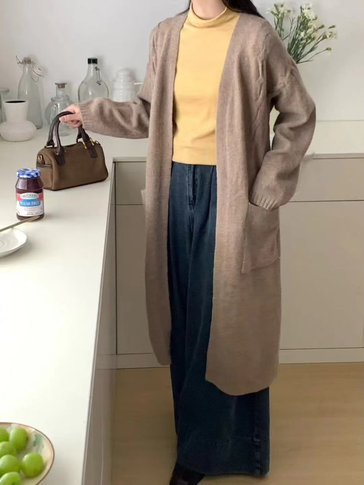 Damer Lång stickad cardigan med praktiska fickor och avslappnad passform Mirla-Eva Jonsson
