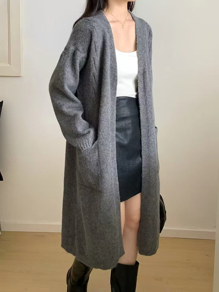 Damer Lång stickad cardigan med praktiska fickor och avslappnad passform Mirla-Eva Jonsson