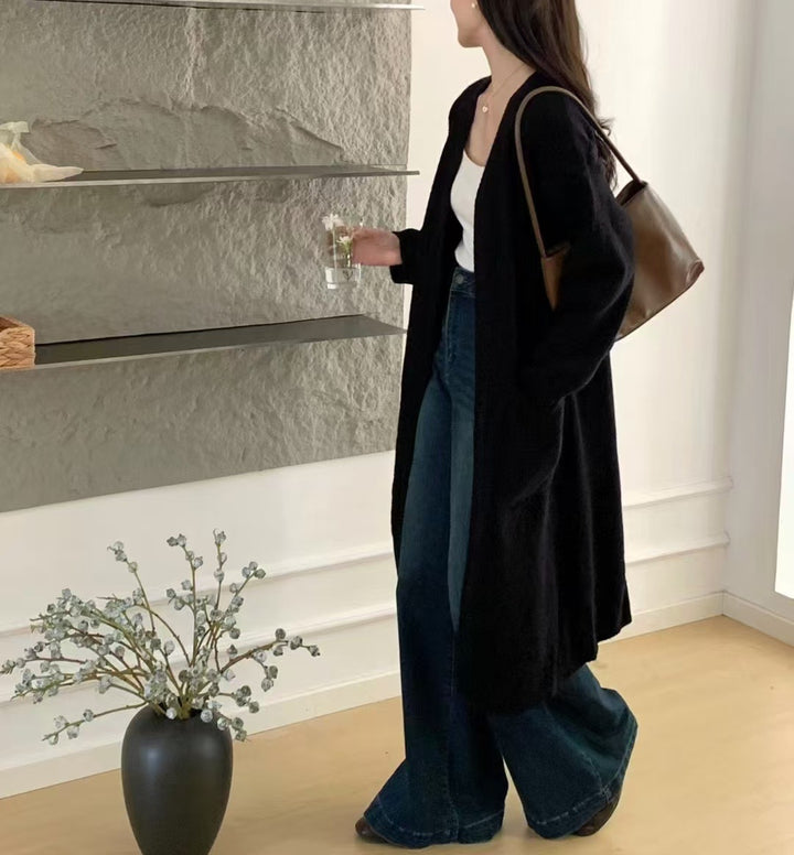 Damer Lång stickad cardigan med praktiska fickor och avslappnad passform Mirla-Eva Jonsson