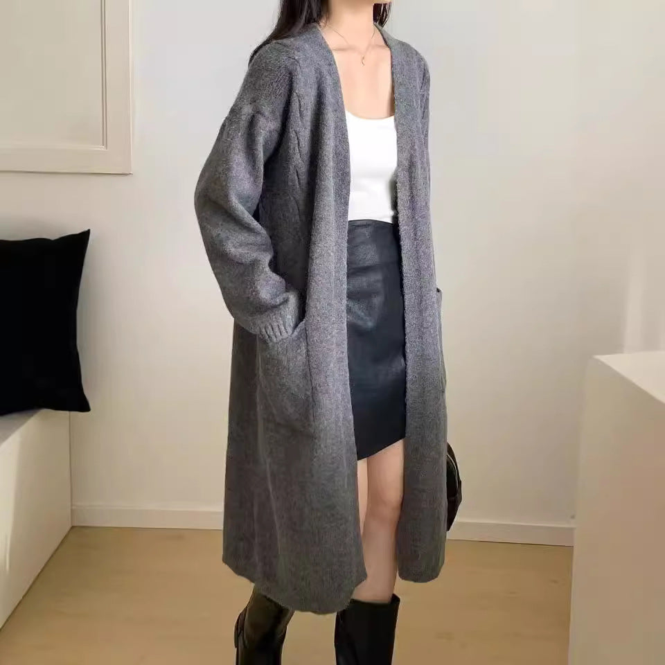 Damer Lång stickad cardigan med praktiska fickor och avslappnad passform Mirla-Eva Jonsson