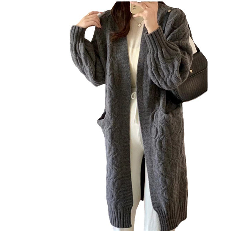 Damer Lång stickad cardigan med voluminösa ärmar och praktiska fickor Eva Jonsson-Eva Jonsson