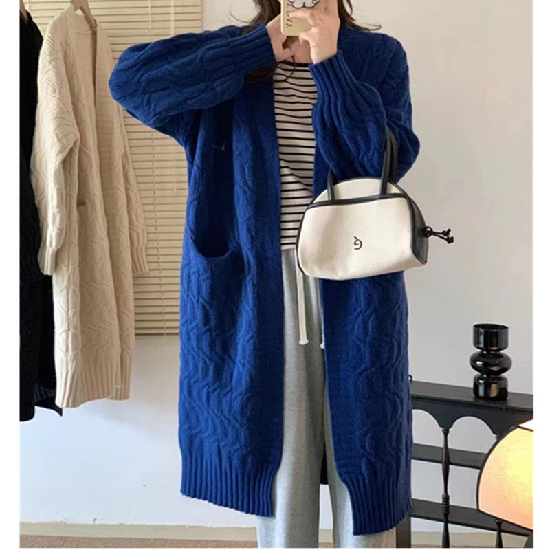 Damer Lång stickad cardigan med voluminösa ärmar och praktiska fickor Eva Jonsson-Eva Jonsson