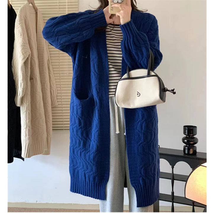 Damer Lång stickad cardigan med voluminösa ärmar och praktiska fickor Eva Jonsson-Eva Jonsson