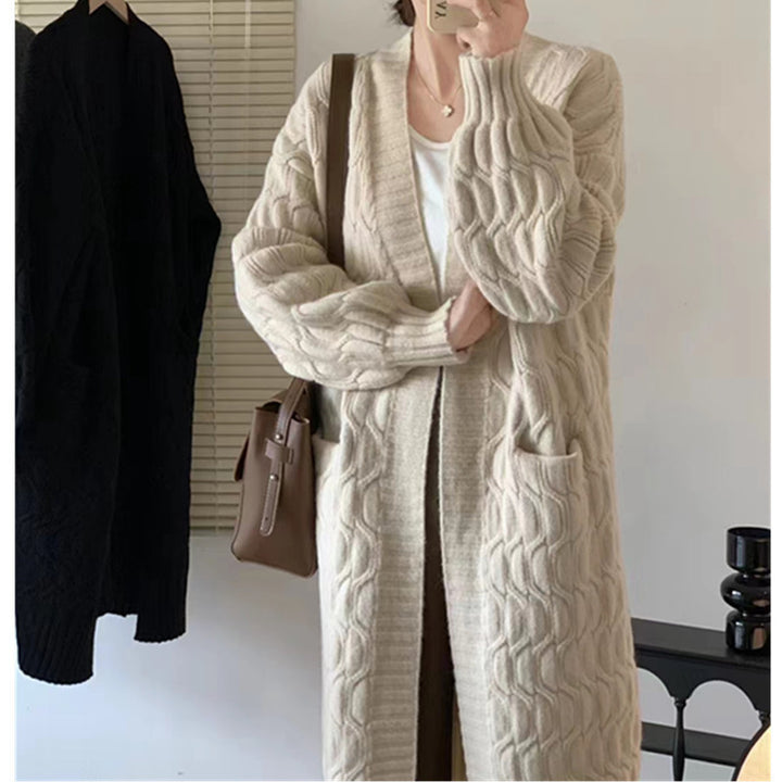Damer Lång stickad cardigan med voluminösa ärmar och praktiska fickor Eva Jonsson-Eva Jonsson