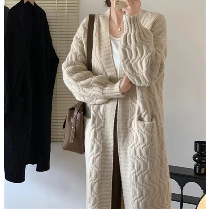 Damer Lång stickad cardigan med voluminösa ärmar och praktiska fickor Eva Jonsson-Eva Jonsson
