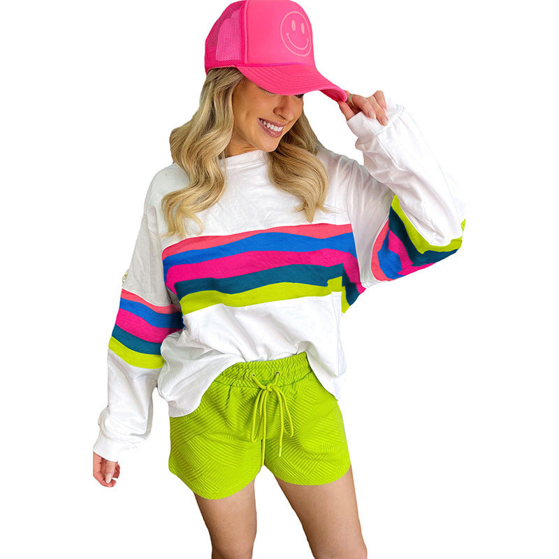 Damer Lätt oversized sweatshirt med färgglada ränder och djup rund halsringning Mirla-Eva Jonsson