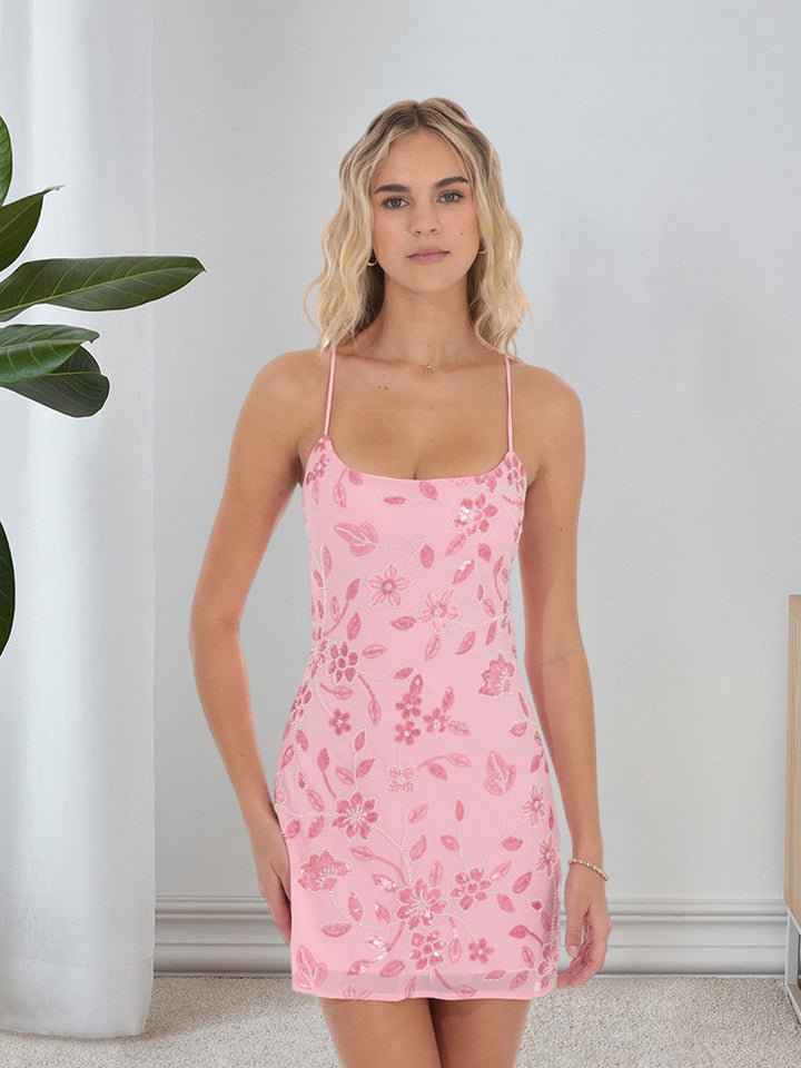 Damer Lekfull mini klänning med blommönster och tunna spaghetti axelband Mirla-Eva Jonsson