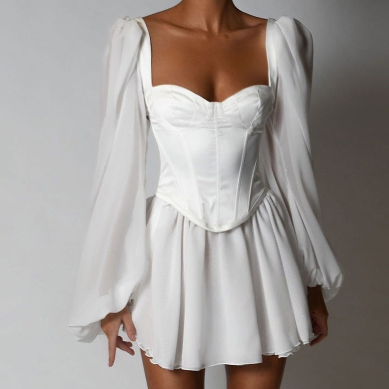 Damer Lekfull miniklänning med elegant bustier-overdel och voluminösa ärmar Eva Jonsson-Eva Jonsson