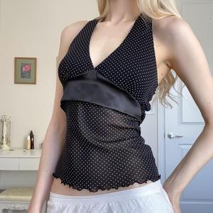 Damer Lekfull spaghetti-top med transparenta accenter och prickar Mirla-Eva Jonsson
