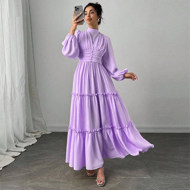 Damer Maxi Klänning med Eleganta Volangdetaljer och Samlad Topp-Eva Jonsson