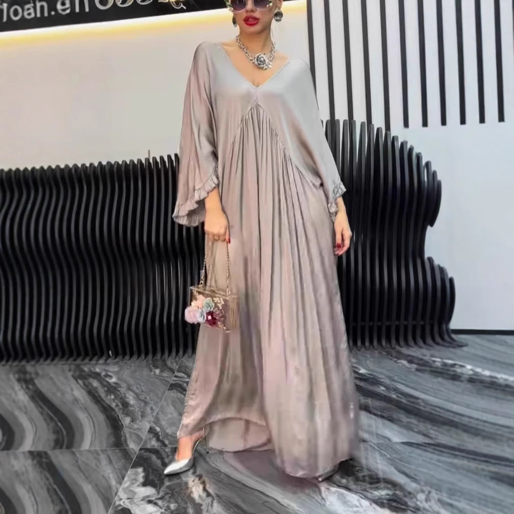 Damer Maxi-klänning med löst skuren design och elegant V-urringning Eva Jonsson-Eva Jonsson