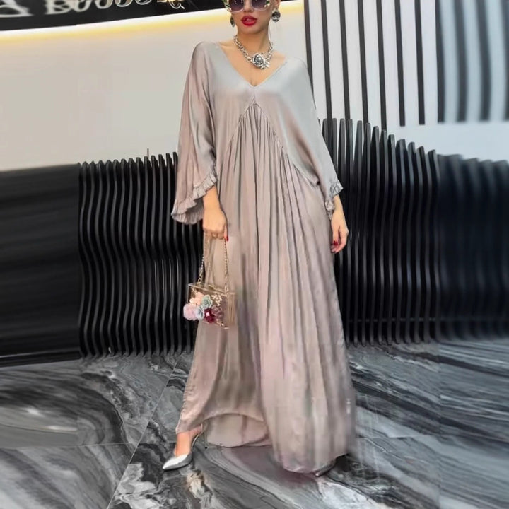 Damer Maxi-klänning med löst skuren design och elegant V-urringning Eva Jonsson-Eva Jonsson