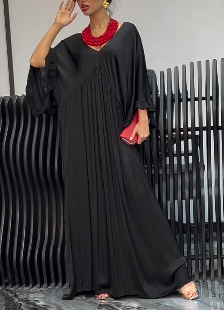 Damer Maxi-klänning med löst skuren design och elegant V-urringning Eva Jonsson-Eva Jonsson
