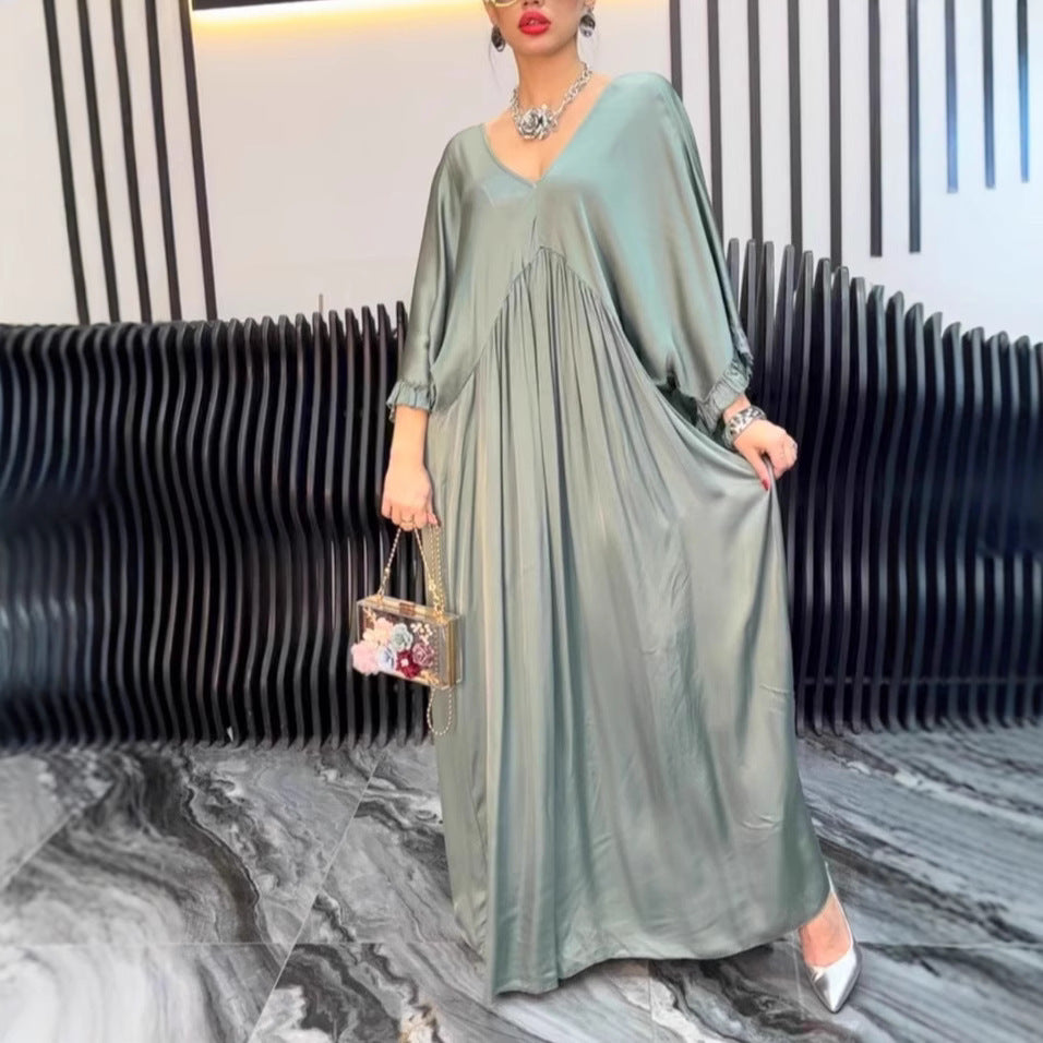 Damer Maxi-klänning med löst skuren design och elegant V-urringning Eva Jonsson-Eva Jonsson