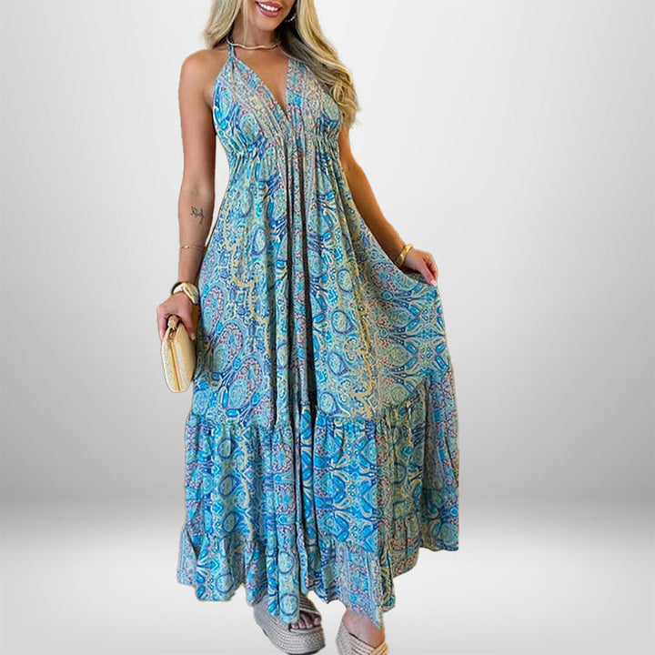 Damer Maxiklänning i lekfull boho-stil med djup V-ringning och svängande kjol Mirla-Eva Jonsson