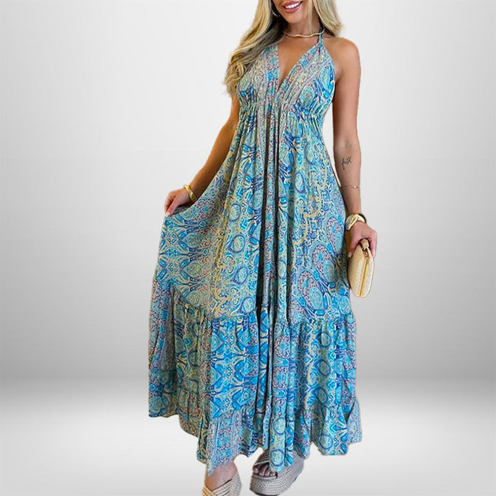 Damer Maxiklänning i lekfull boho-stil med djup V-ringning och svängande kjol Mirla-Eva Jonsson