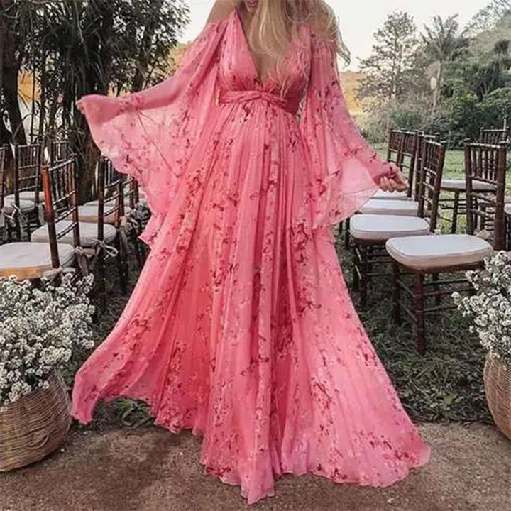 Damer Maxiklänning med Svängande Ärmar och Blommigt Mönster Mirla-Eva Jonsson