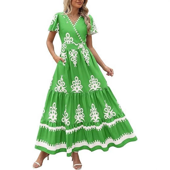 Damer Maxiklänning med V-urringning och kontrasterande broderidetaljer Mirla-Eva Jonsson