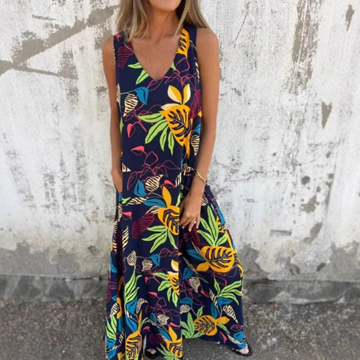 Damer Maxiklänning med blommönster och praktiska sidfickor Mirla-Eva Jonsson