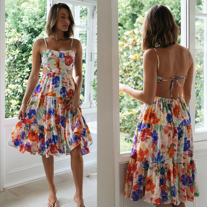 Damer Midi-Claudia klänning med lekfullt blommönster och flödande kjol Mirla-Eva Jonsson