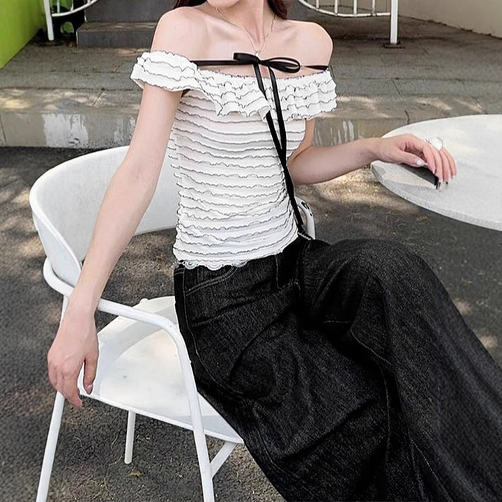 Damer Offshoulder-blus med elegant vågmönster Mirla-Eva Jonsson