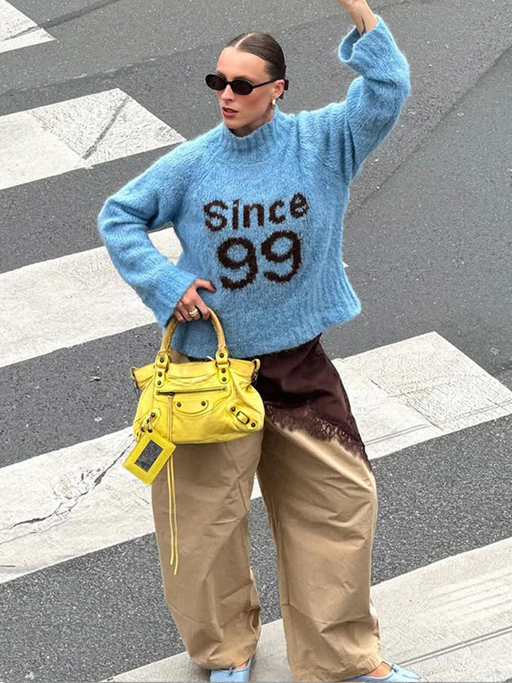 Damer Oversized Stickad tröja med hög krage och unik text Mirla-Eva Jonsson