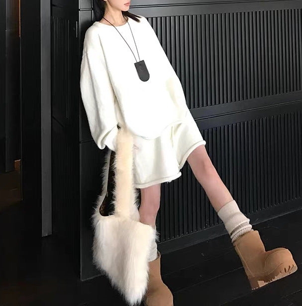 Damer Oversized Tröja med asymmetrisk skärning och moderiktig krage Mirla-Eva Jonsson