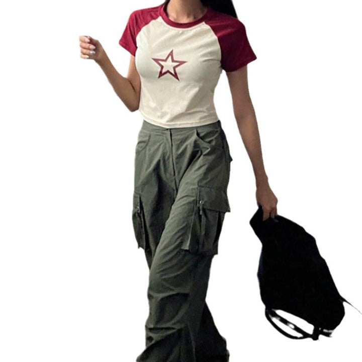 Damer Raglan-Crop-Shirt med iögonfallande stjärnmotiv Mirla-Eva Jonsson