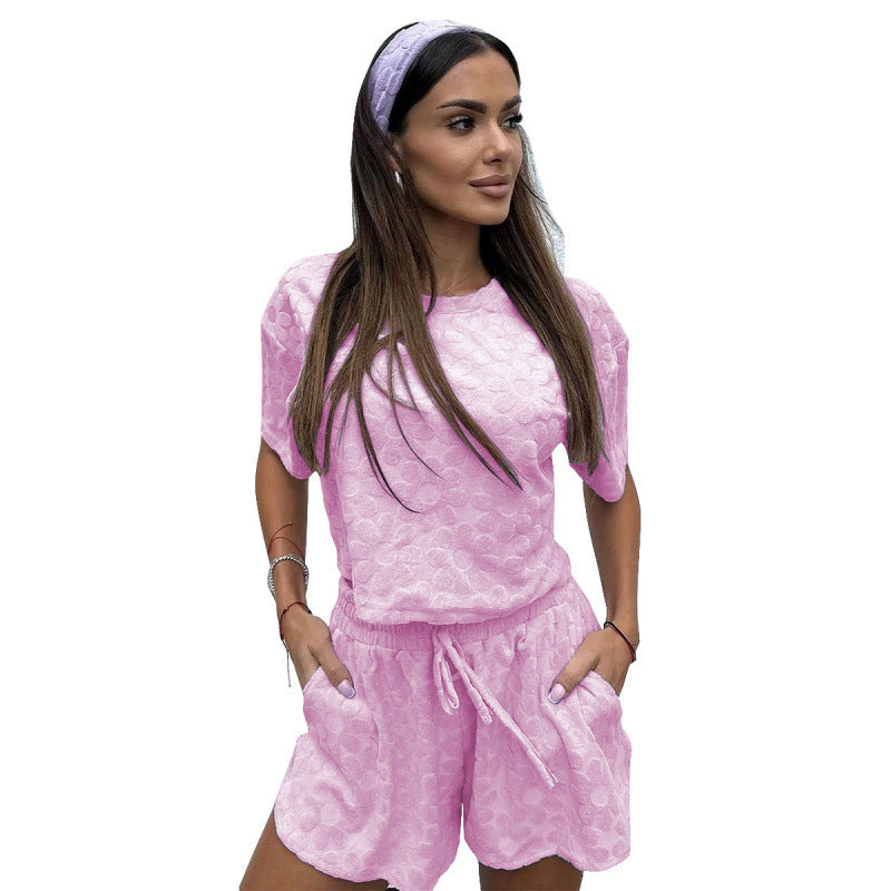 Damer Sportigt Tvådelat Set med Luftiga Shorts och T-shirt Mirla-Eva Jonsson