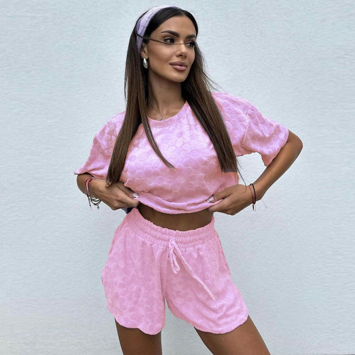Damer Sportigt Tvådelat Set med Luftiga Shorts och T-shirt Mirla-Eva Jonsson