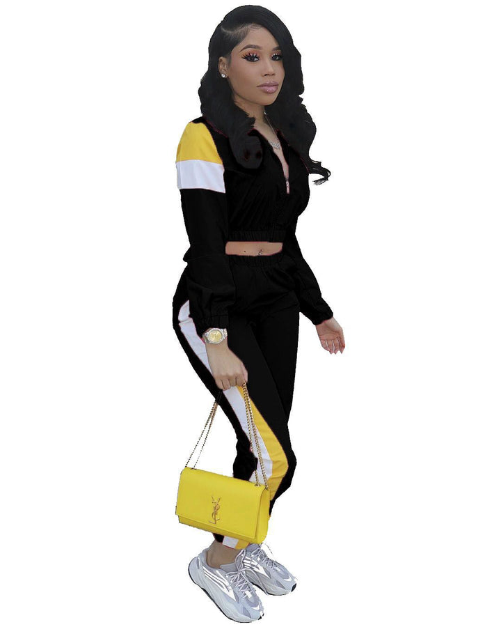 Damer Sportigt Tvådelat Set med trendig Crop-Top och slim Joggingbyxor Mirla-Eva Jonsson
