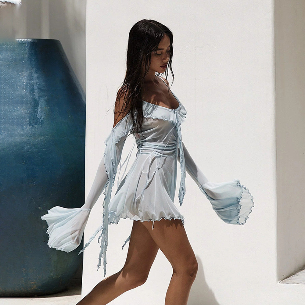 Damer Transparent Strandmode med voluminösa Volangdetaljer Mirla-Eva Jonsson