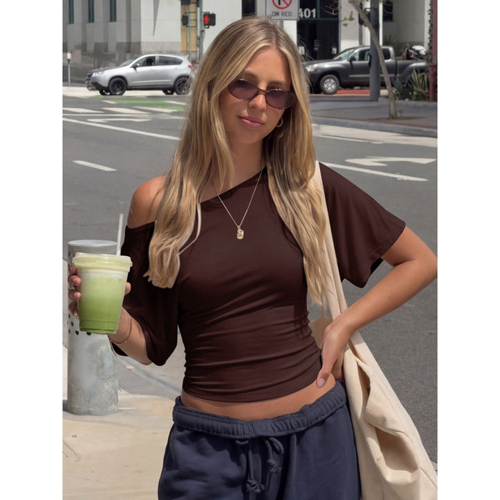 Damer asymmetrisk crop-top med vid passform och flödande ärmar Mirla-Eva Jonsson