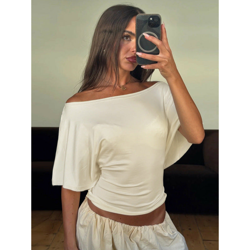 Damer asymmetrisk crop-top med vid passform och flödande ärmar Mirla-Eva Jonsson