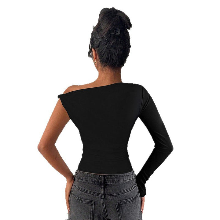 Damer asymmetrisk långärmad topp med off-shoulder design Mirla-Eva Jonsson