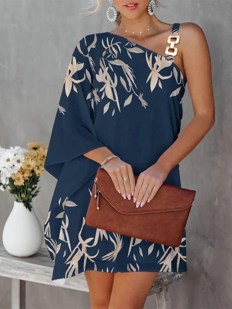 Damer asymmetrisk modeklänning med blommönster och elegant axelrem Eva Jonsson-Eva Jonsson