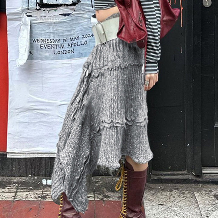 Damer asymmetrisk stickad jacka med trendiga ribbdetaljer och knutdetaljer Mirla-Eva Jonsson