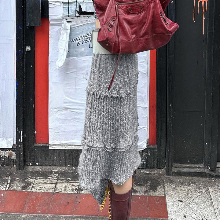 Damer asymmetrisk stickad jacka med trendiga ribbdetaljer och knutdetaljer Mirla-Eva Jonsson