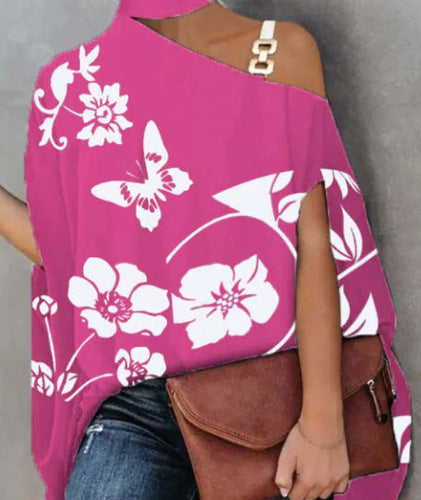 Damer asymmetrisk topp med blommotiv Mirla-Eva Jonsson