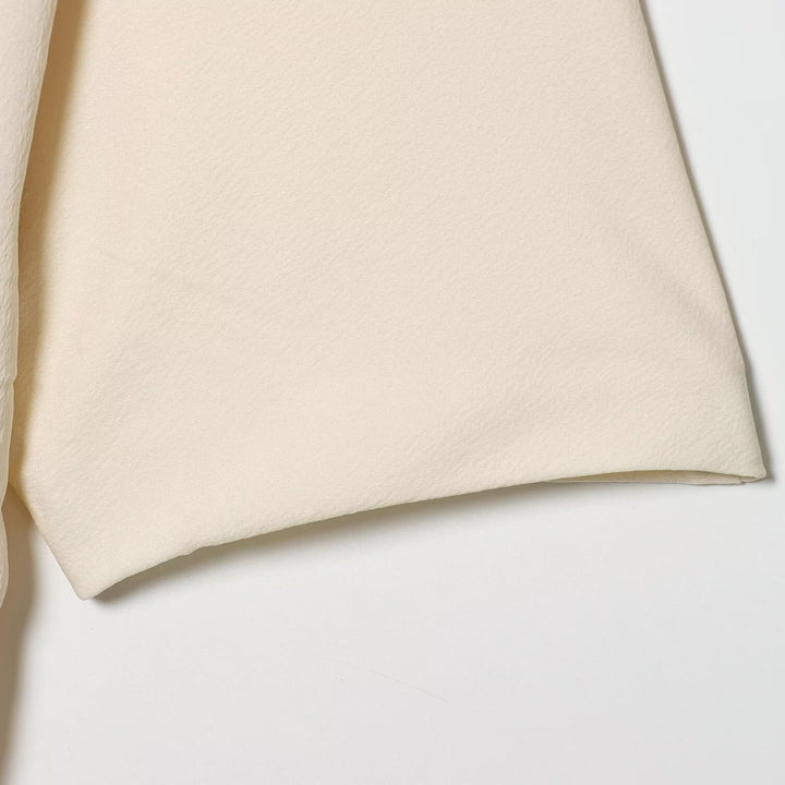 Damer asymmetrisk topp med elegant drapering Mirla-Eva Jonsson