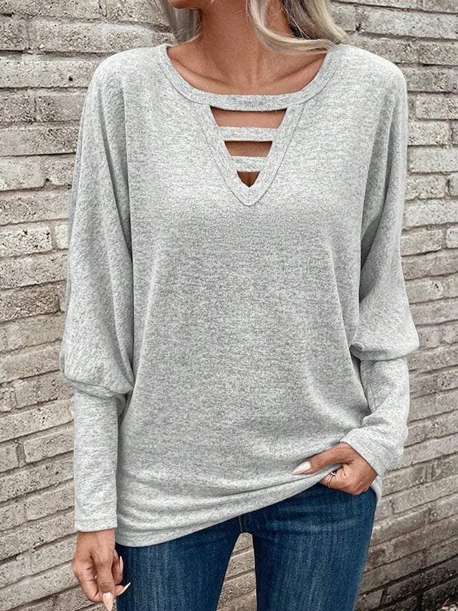Damer avslappnad V-ringad topp med cut-out-detaljer Mirla-Eva Jonsson