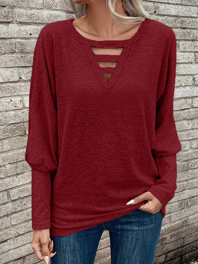 Damer avslappnad V-ringad topp med cut-out-detaljer Mirla-Eva Jonsson