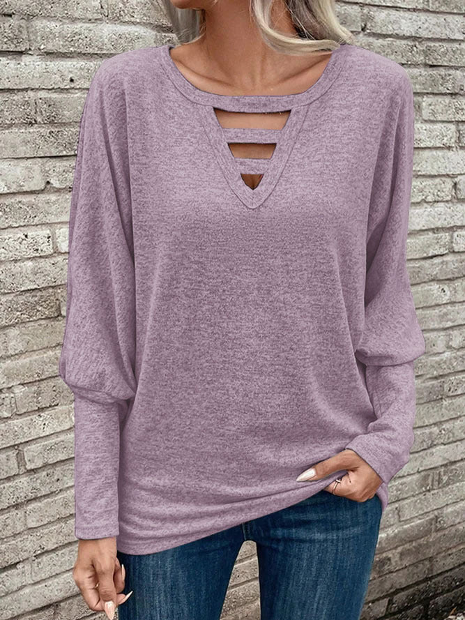 Damer avslappnad V-ringad topp med cut-out-detaljer Mirla-Eva Jonsson