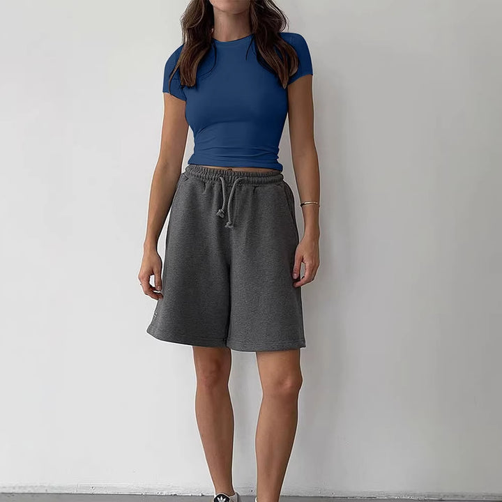 Damer avslappnad cropped T-shirt i hudvänligt material med rundad halsringning Mirla-Eva Jonsson