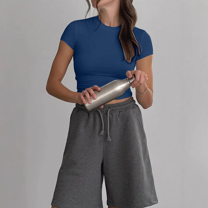 Damer avslappnad cropped T-shirt i hudvänligt material med rundad halsringning Mirla-Eva Jonsson