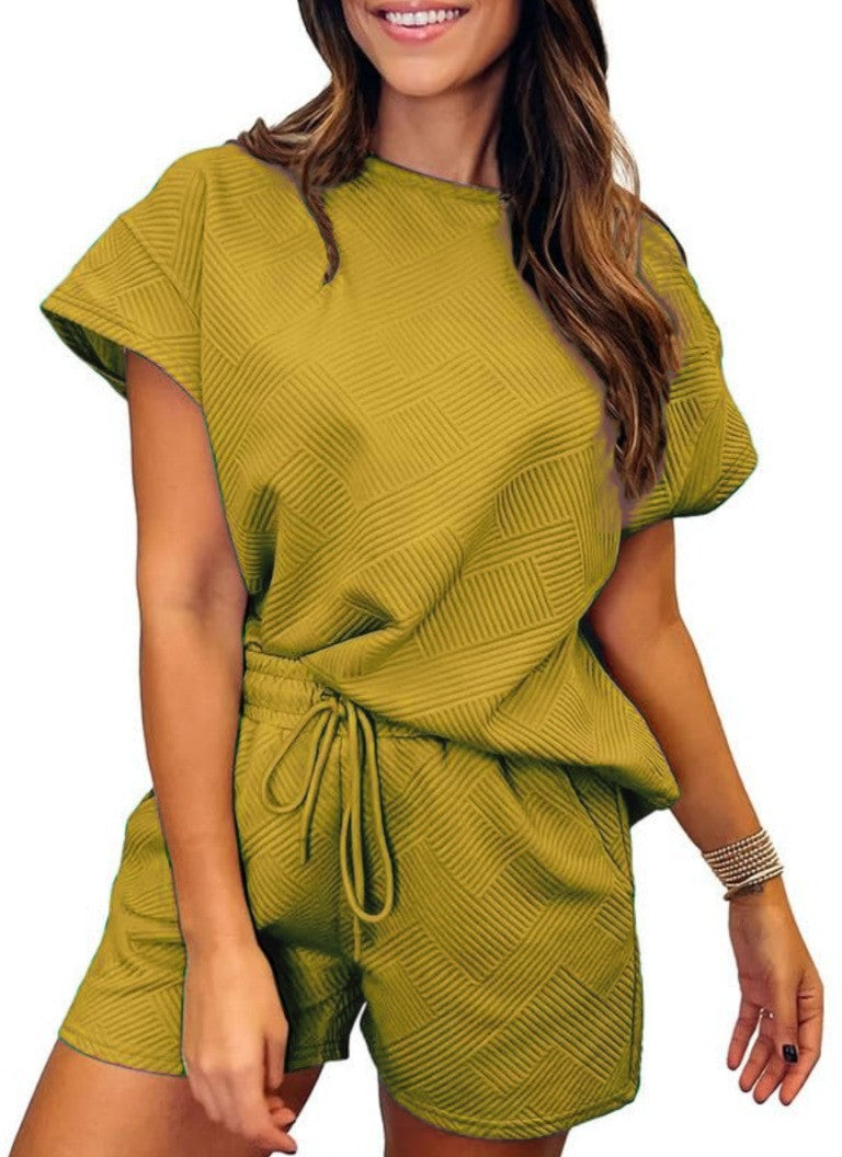 Damer avslappnad jumpsuit-set med elastisk midja och strukturerad design Mirla-Eva Jonsson