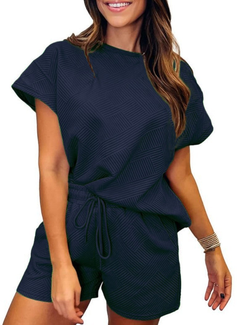 Damer avslappnad jumpsuit-set med elastisk midja och strukturerad design Mirla-Eva Jonsson