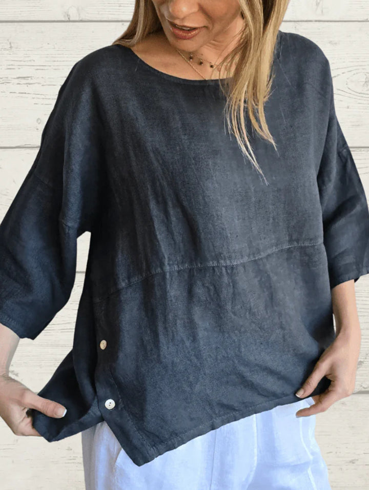 Damer avslappnad linneöverdel med asymmetrisk fåll och knapppdetaljer Mirla-Eva Jonsson